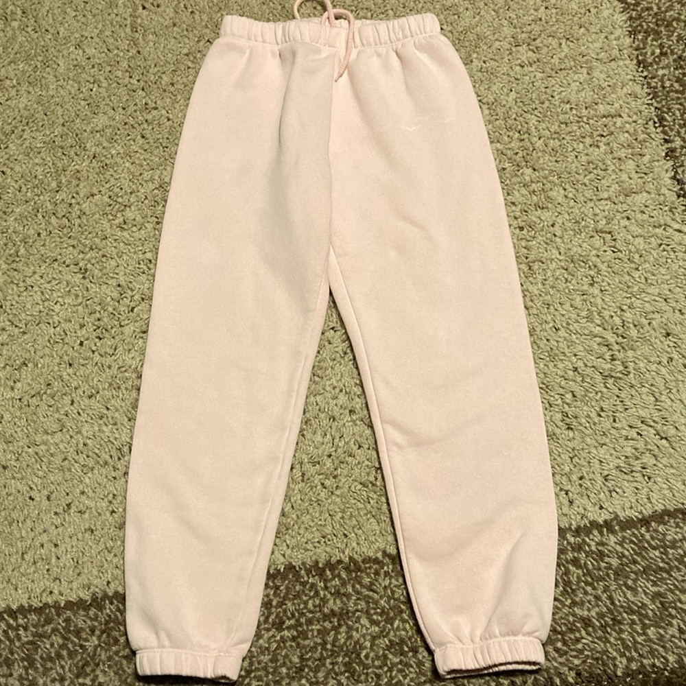 Lazypants pink joggers with three birds on the side.